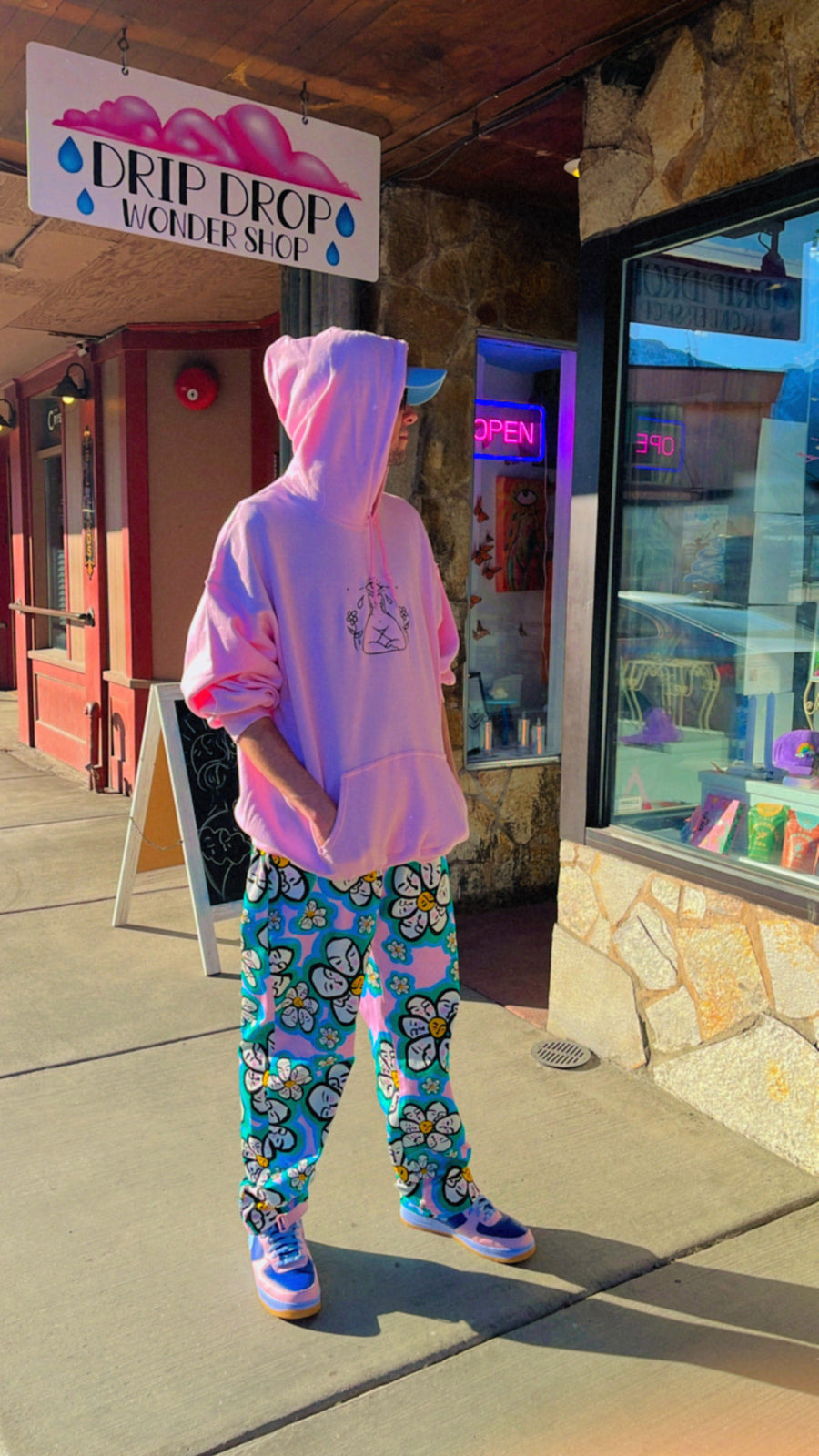 Customer wearing How to See Embroidered Hoodie