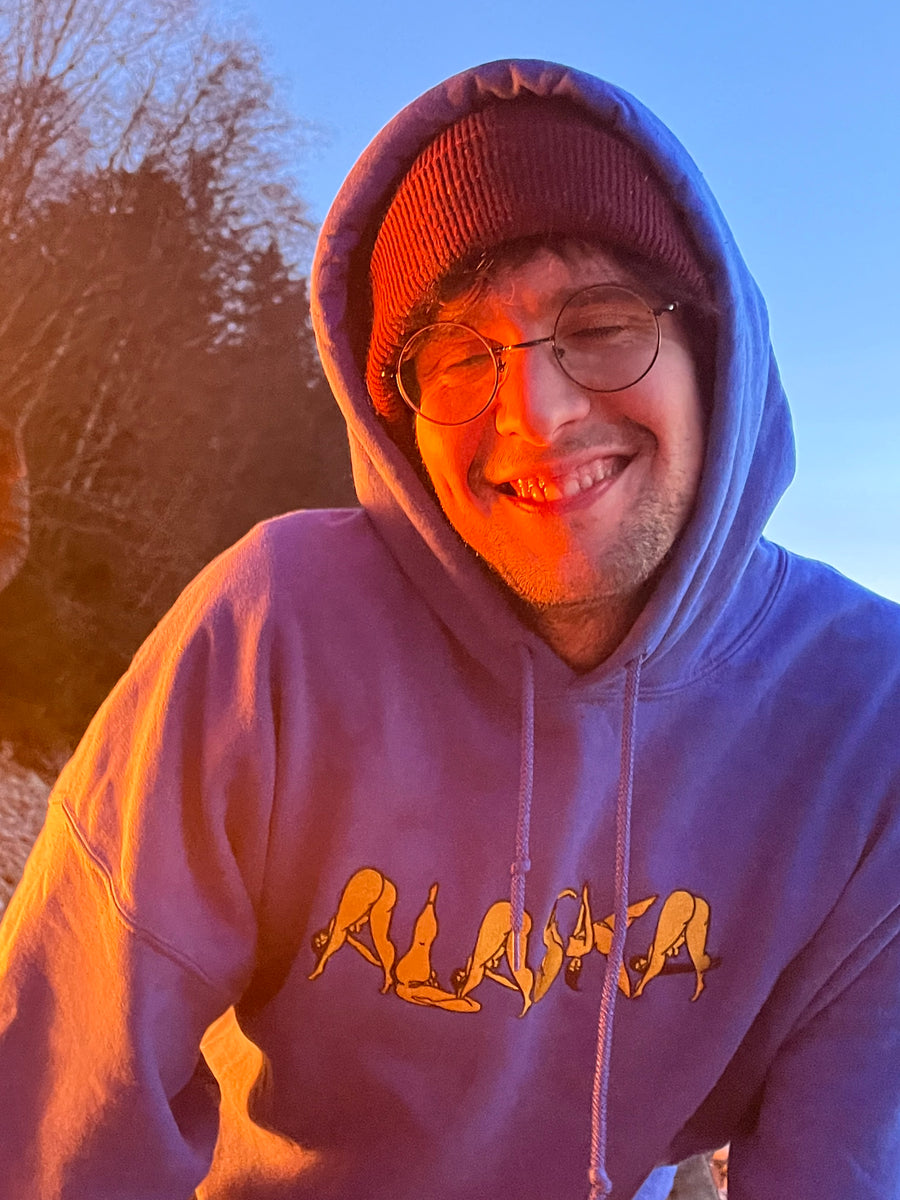 Customer wearing Alaska Embroidered Heavy Blend Hoodie in Blue